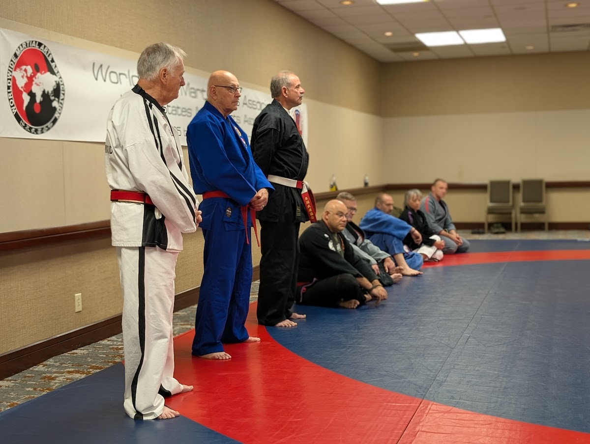 Students practicing jiu-jitsu grappling techniques during WWMAA intensive training camp